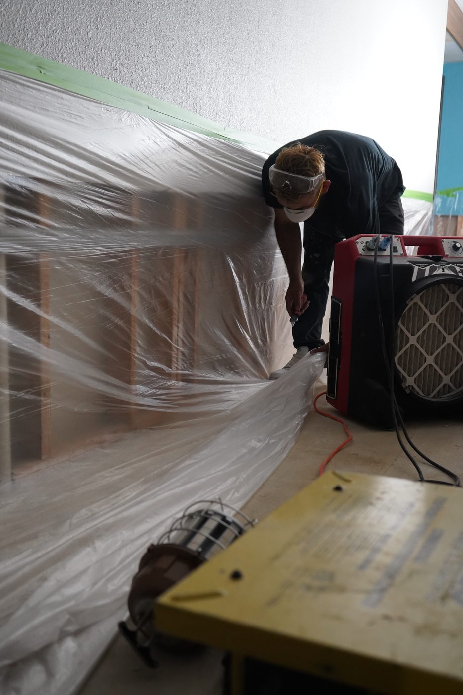 Revive technician in PPE setting up containment